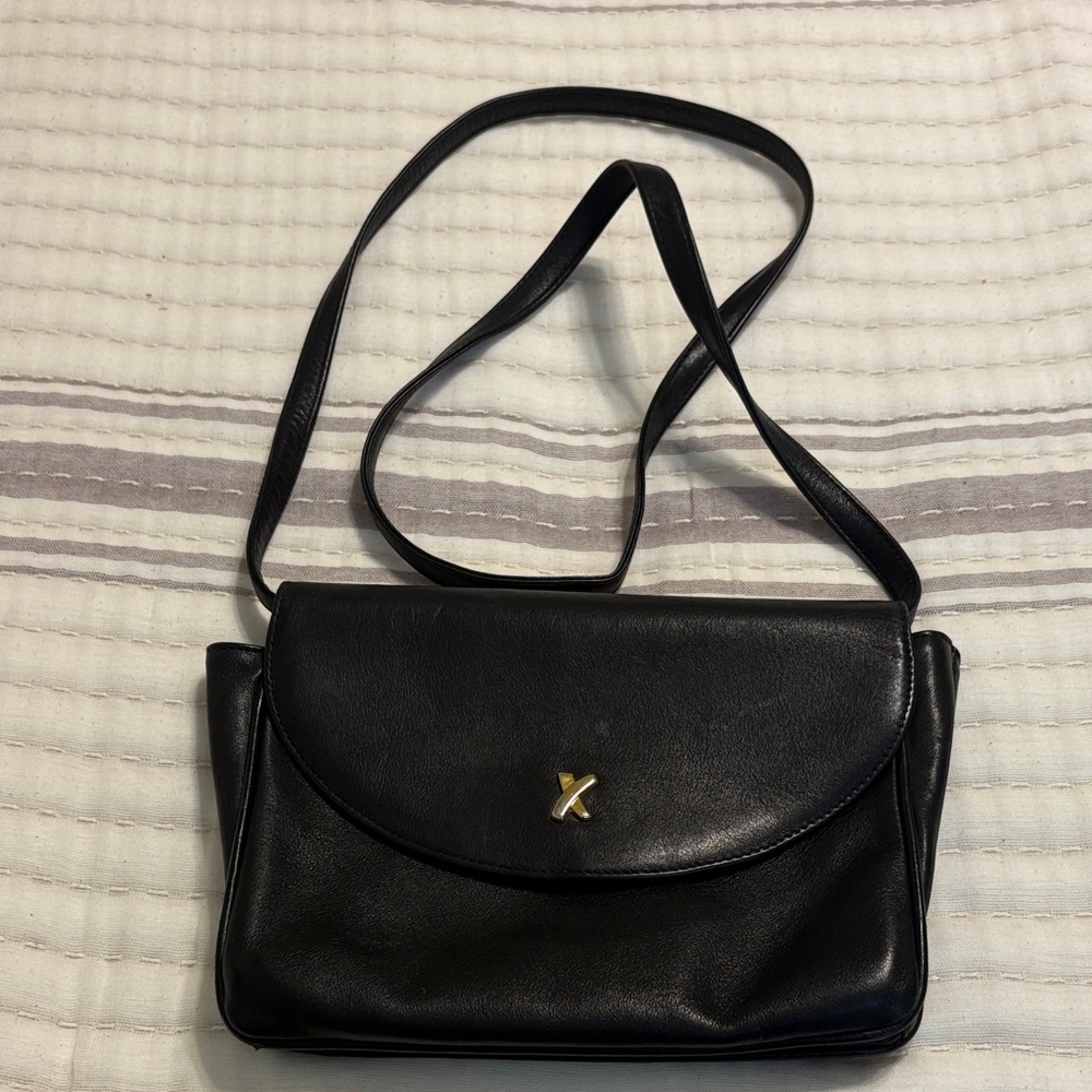 Paloma Picasso Black Leather Crossbody Bag
61/2” x10”
Very clean inside